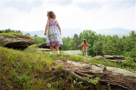 Girls playing on rocks Stock Photo - Premium Royalty-Free, Code: 614-06336288