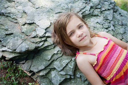 rock girls - Girl lying on rocks Stock Photo - Premium Royalty-Free, Code: 614-06336309