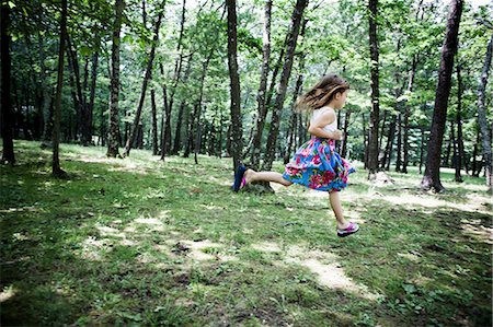 playing tree - Girl running in forest Stock Photo - Premium Royalty-Free, Code: 614-06336302