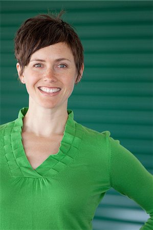 portrait green - Woman against green background, portrait Stock Photo - Premium Royalty-Free, Code: 614-06336381