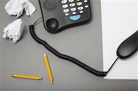 simsearch:614-06336430,k - Landline office phone off the hook with pencil and paper, high angle Stock Photo - Premium Royalty-Free, Code: 614-06336396