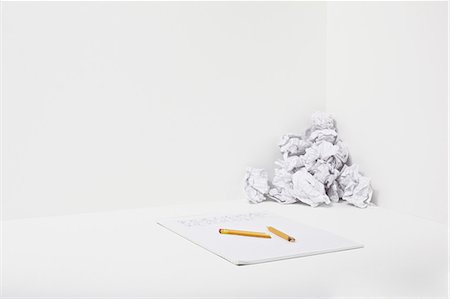 paper stack on white background - Broken pencil, notebook and crumpled paper Stock Photo - Premium Royalty-Free, Code: 614-06336391