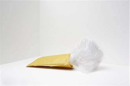 simsearch:614-06336405,k - Padded envelope with plastic coming out Stock Photo - Premium Royalty-Free, Code: 614-06336415