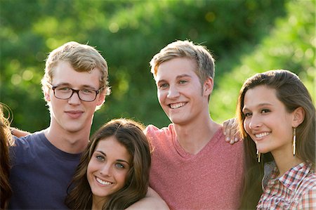 simsearch:614-06402544,k - Portrait of four friends with arms around each other Stock Photo - Premium Royalty-Free, Code: 614-06402535