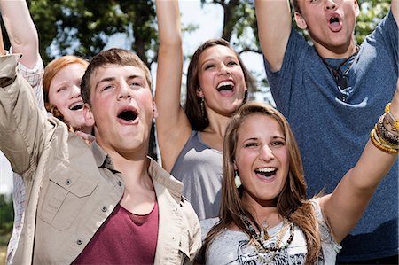 smiling teenage girl - Five friends cheering, close up Stock Photo - Premium Royalty-Free, Code: 614-06402609