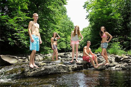 Portrait of friends by river Stock Photo - Premium Royalty-Free, Code: 614-06402616
