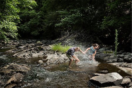 simsearch:614-06402622,k - Couple playing in river Stock Photo - Premium Royalty-Free, Code: 614-06402625