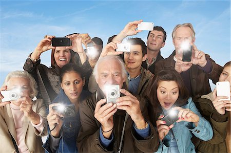 person with camera - Group of people taking photographs Stock Photo - Premium Royalty-Free, Code: 614-06402707