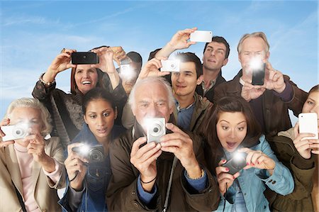 senior citizen asian - Group of people taking photographs Stock Photo - Premium Royalty-Free, Code: 614-06402707