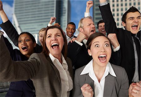 Businesspeople cheering with excitement Stock Photo - Premium Royalty-Free, Code: 614-06402722