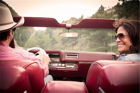 Couple in a convertible car Stock Photo - Premium Royalty-Free, Code: 614-06402853