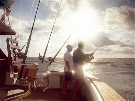 Hommes du bateau de pêche sportive de pêche Photographie de stock - Premium Libres de Droits, Code: 614-06402872