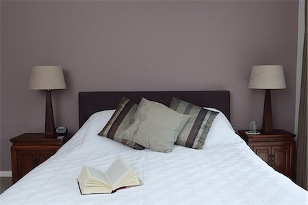 double bed - Bedroom with open book on bed Stock Photo - Premium Royalty-Free, Code: 614-06402977