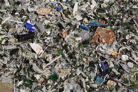 environmental pollution of garbage - Broken glass and other debris at waste management site Stock Photo - Premium Royalty-Free, Code: 614-06403010