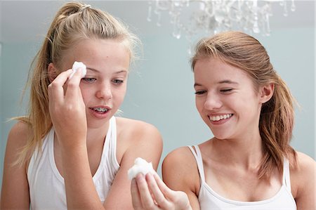 dirt in face with smile - Teenage girls cleansing Stock Photo - Premium Royalty-Free, Code: 614-06403038