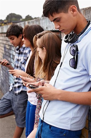 simsearch:614-06403066,k - Teenagers using cellphones Stock Photo - Premium Royalty-Free, Code: 614-06403090