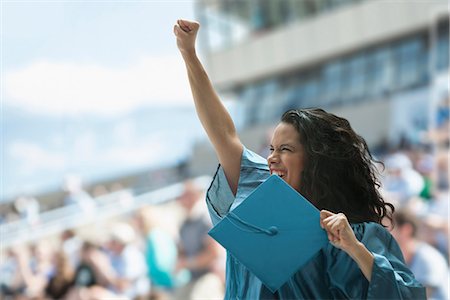 schulabschluss - Female graduate raising fist Foto de stock - Sin royalties Premium, Código: 614-06442275