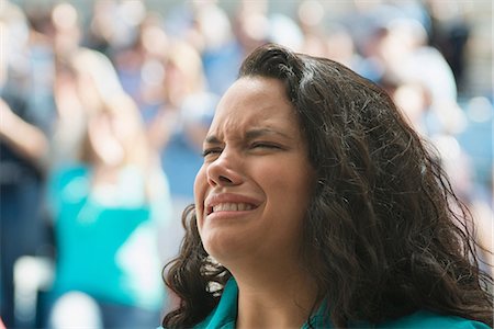 failure - Female spectator looking upset Stock Photo - Premium Royalty-Free, Code: 614-06442277