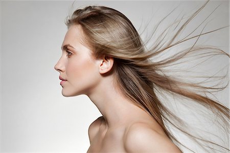 rostro - Woman with windswept long hair Foto de stock - Sin royalties Premium, Código: 614-06442334