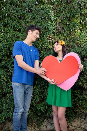 red hearts - Couple holding heart shape Stock Photo - Premium Royalty-Free, Code: 614-06442419