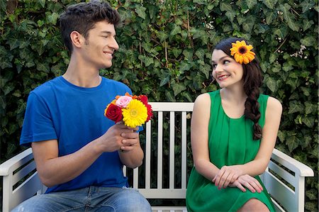 simsearch:614-06442432,k - Couple on bench, man holding flowers Stock Photo - Premium Royalty-Free, Code: 614-06442442