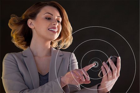 Businesswoman using smartphone touch screen with circles Foto de stock - Sin royalties Premium, Código: 614-06442499