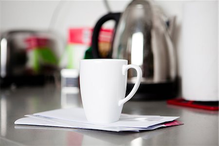 routine - Coffee mug on top of envelopes Stock Photo - Premium Royalty-Free, Code: 614-06442523