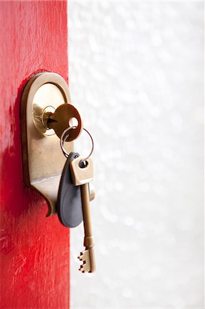 Close up of house keys in front door Fotografie stock - Premium Royalty-Free, Codice: 614-06442537