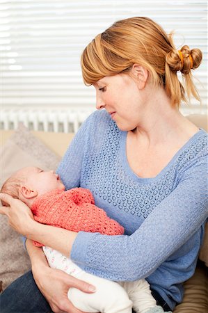 Mother holding newborn daughter Stock Photo - Premium Royalty-Free, Code: 614-06442550
