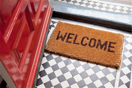 front door of home - Welcome mat Stock Photo - Premium Royalty-Free, Code: 614-06442568