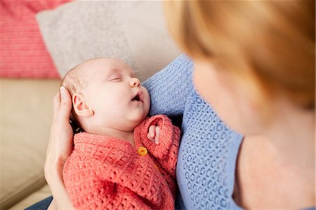 parent baby sleeping - Mother holding newborn daughter Stock Photo - Premium Royalty-Free, Code: 614-06442569