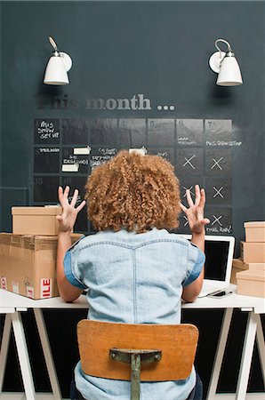 someone sitting at a desk backside - Frustrated woman working from home Stock Photo - Premium Royalty-Free, Code: 614-06442592