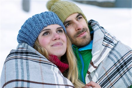 rosy cheeks - Portrait of couple wearing knit hats, wrapped in blanket Stock Photo - Premium Royalty-Free, Code: 614-06442706
