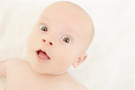 surprised people eye contact - Baby girl staring at camera Stock Photo - Premium Royalty-Free, Code: 614-06442839