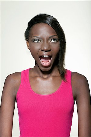 portrait screaming girl - Teenage girl pulling faces Stock Photo - Premium Royalty-Free, Code: 614-06442856