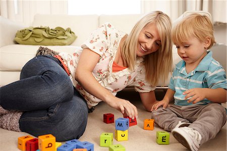 parent education child - Mother and son playing with alphabet blocks Stock Photo - Premium Royalty-Free, Code: 614-06443005