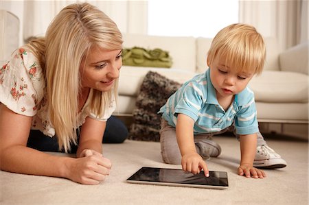 parent and toddler - Mother and son using digital tablet Stock Photo - Premium Royalty-Free, Code: 614-06443007