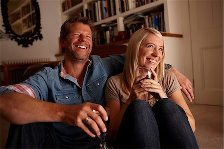 Couple drinking wine at home Stock Photo - Premium Royalty-Free, Code: 614-06443045