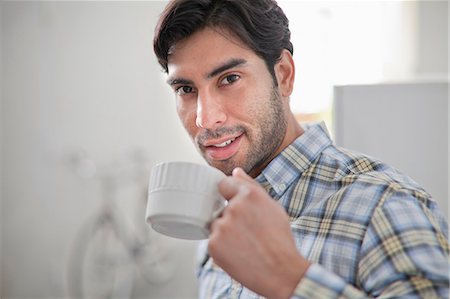 simsearch:614-06536828,k - Man drinking cup of coffee in kitchen Stock Photo - Premium Royalty-Free, Code: 614-06536777