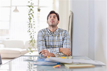 Businessman at work in kitchen Stock Photo - Premium Royalty-Free, Code: 614-06536779