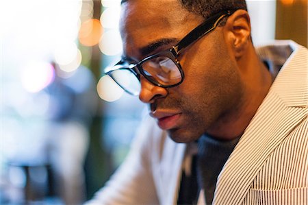 Close up of man wearing glasses Stock Photo - Premium Royalty-Free, Code: 614-06536802