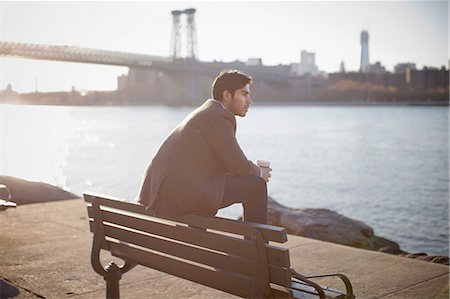 daydreaming (eyes open) - Man with cup of coffee on park bench Foto de stock - Sin royalties Premium, Código: 614-06536812