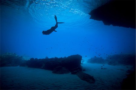 diving men - Woman snorkeling in tropical water Stock Photo - Premium Royalty-Free, Code: 614-06536839