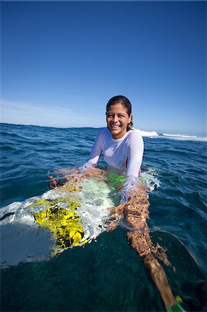 simsearch:614-06536825,k - Girl sitting on surfboard in water Stock Photo - Premium Royalty-Free, Code: 614-06536886