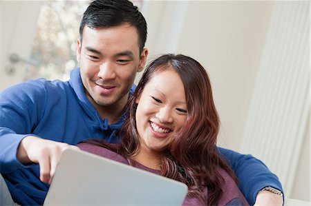 romantic boy hug images - Couple using tablet computer together Photographie de stock - Premium Libres de Droits, Code: 614-06536916