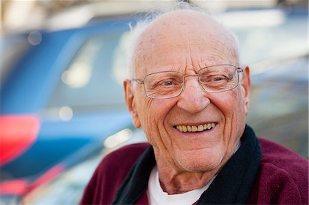 eyeglasses detail - Close up of older man's smiling face Stock Photo - Premium Royalty-Free, Code: 614-06536948