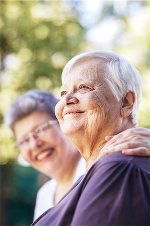 senior looking out - Older women smiling together outdoors Stock Photo - Premium Royalty-Free, Code: 614-06536952