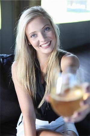 simsearch:614-06537619,k - Woman offering glass of wine Stock Photo - Premium Royalty-Free, Code: 614-06536976