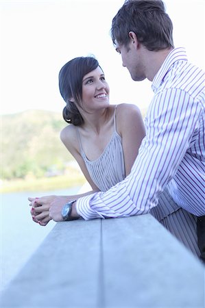 Couple smiling together outdoors Stock Photo - Premium Royalty-Free, Code: 614-06536983