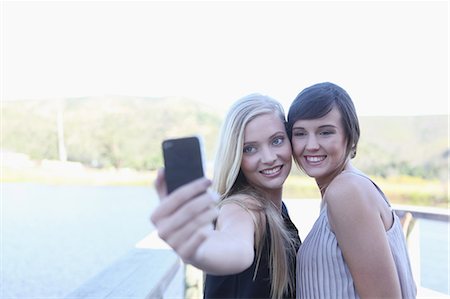 Women taking picture of themselves Stock Photo - Premium Royalty-Free, Code: 614-06536991